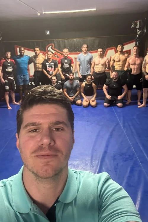 Urosh and a group of guys in training gym