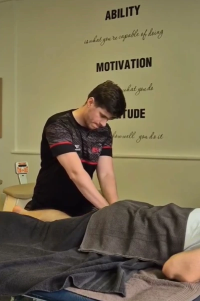 Urosh giving a sports massage to a patient